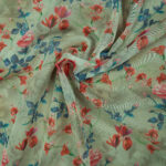 Digital floral print on light green glass organza fabric